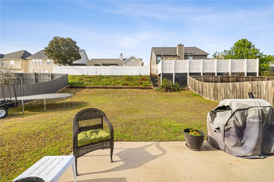 874 Wild Orchard Lane Woodruff, SC 29388 - Photo 29 of 35 This spacious yard offers a serene retreat with ample green space and a private patio.