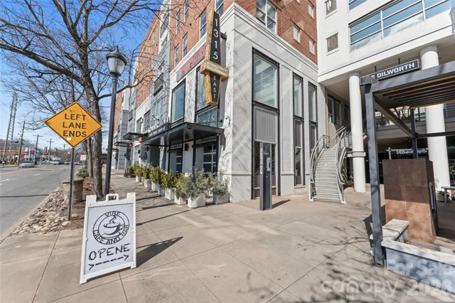 a view of a building with a tree