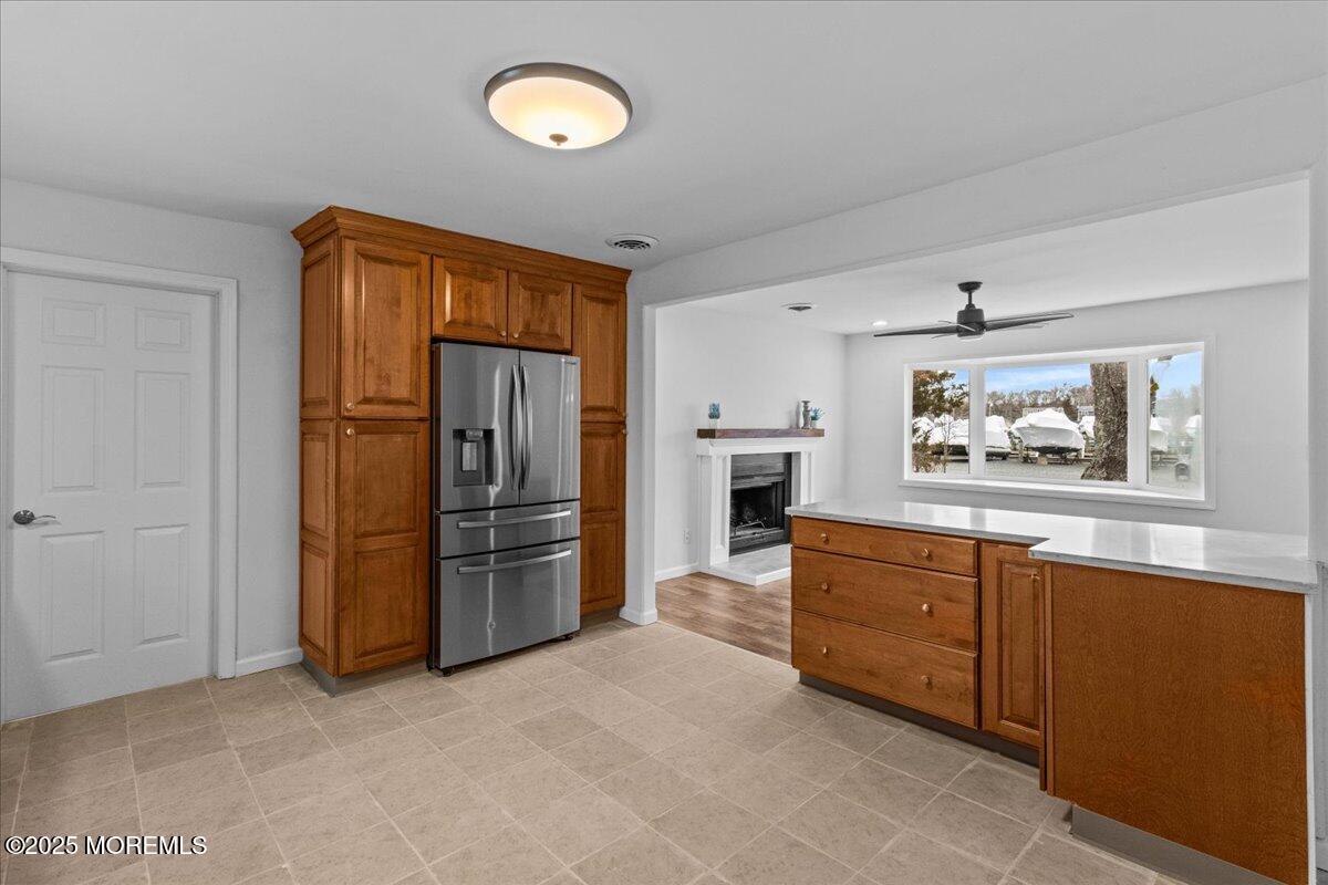 98 Marine Road Waretown, NJ 08758 - Photo 16 of 40 a large kitchen with stainless steel appliances a refrigerator and a stove top oven