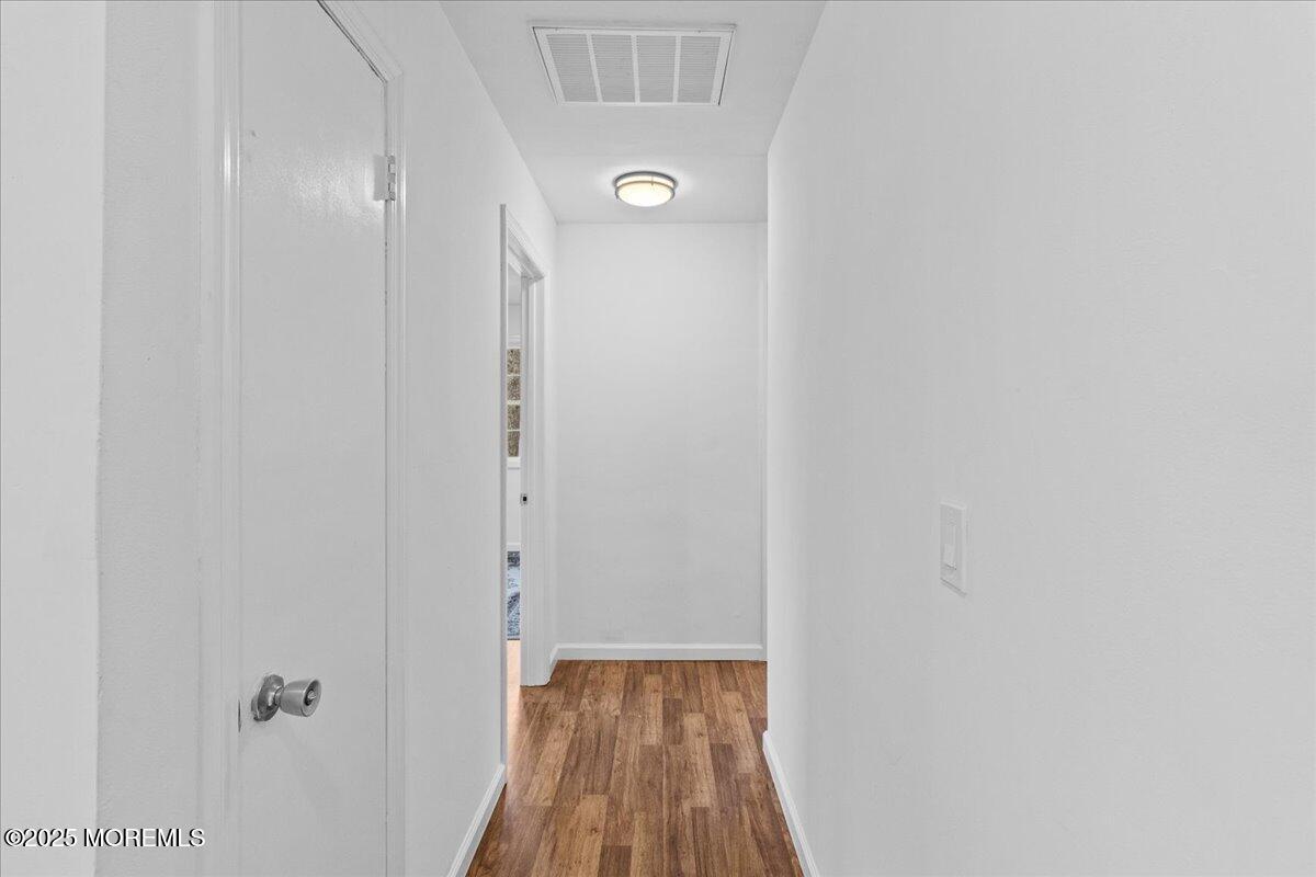 98 Marine Road Waretown, NJ 08758 - Photo 19 of 40 a view of a hallway with wooden floor
