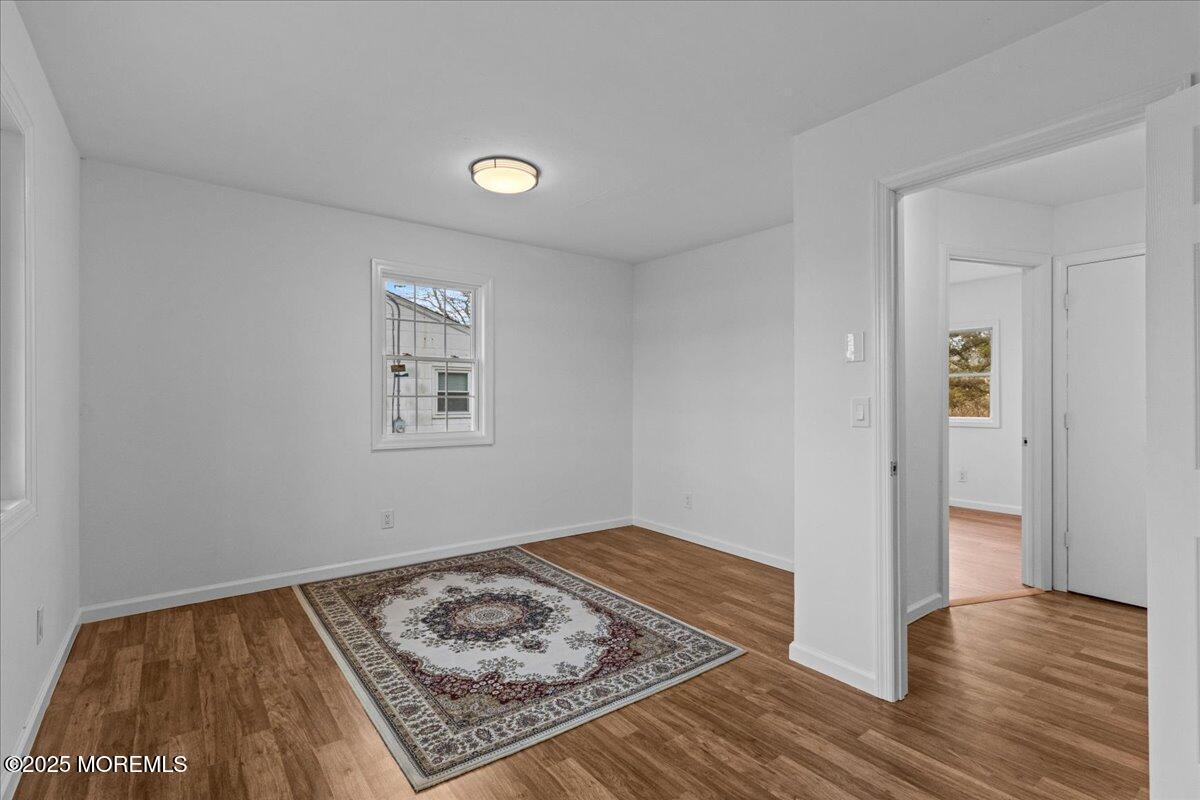 98 Marine Road Waretown, NJ 08758 - Photo 23 of 40 a view of a room with wooden floor and window
