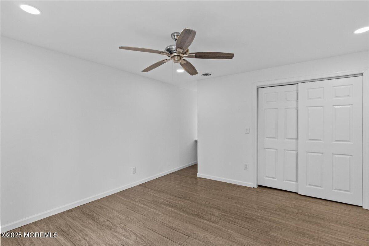 98 Marine Road Waretown, NJ 08758 - Photo 30 of 40 a view of an empty room with wooden floor