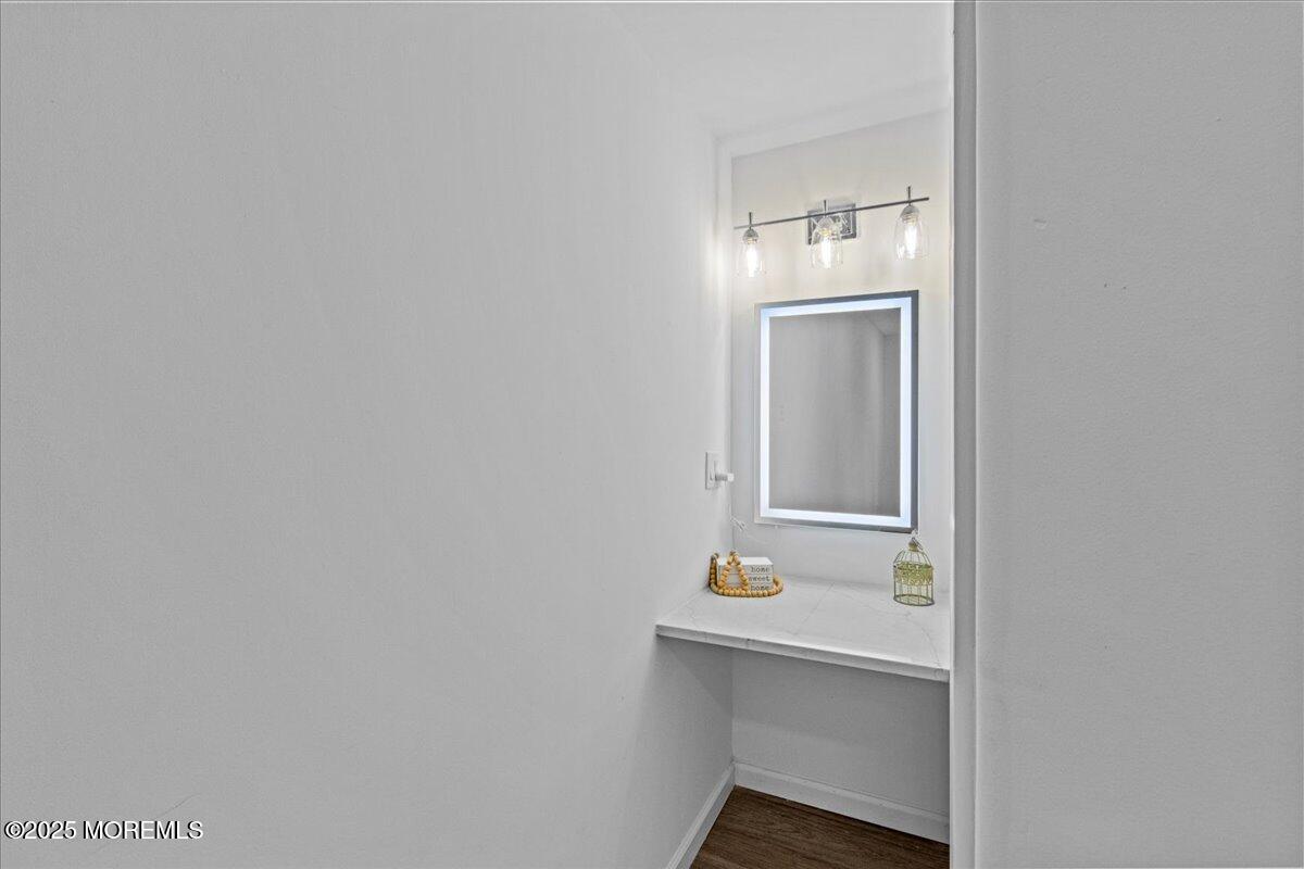 98 Marine Road Waretown, NJ 08758 - Photo 31 of 40 a bathroom with a sink a mirror and vanity
