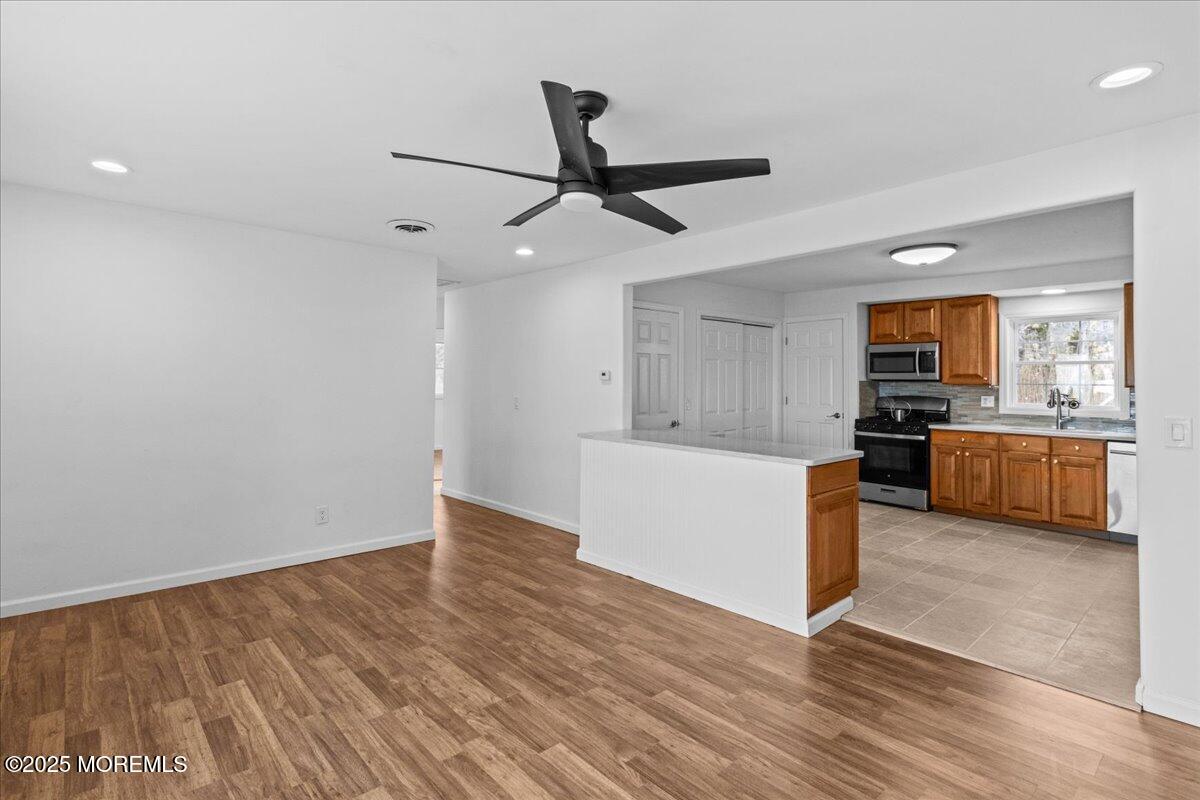 98 Marine Road Waretown, NJ 08758 - Photo 10 of 40 a view of a kitchen with microwave and cabinets