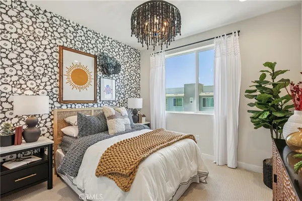 a bedroom with bed and a window