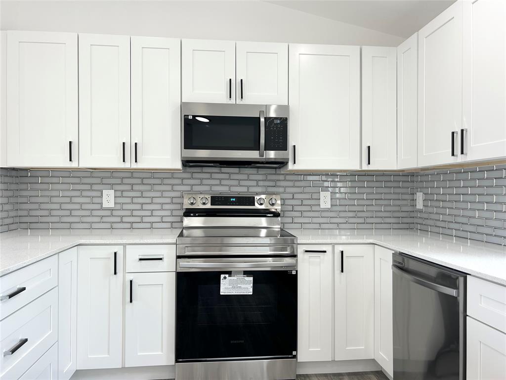 136 Lincoln Road Northwest Lake Placid, FL 33852 - Photo 12 of 31 a kitchen with cabinets stainless steel appliances and sink