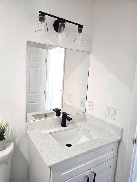 136 Lincoln Road Northwest Lake Placid, FL 33852 - Photo 22 of 31 a bathroom with a sink and a mirror