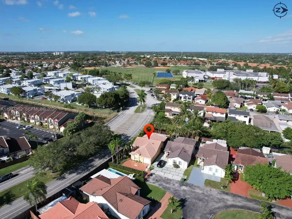 an aerial view of residential houses with outdoor space
