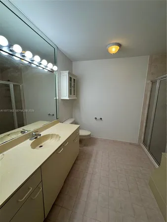 a bathroom with a sink and a shower