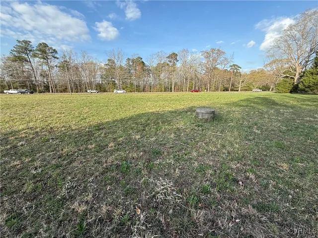 a view of a field with an trees