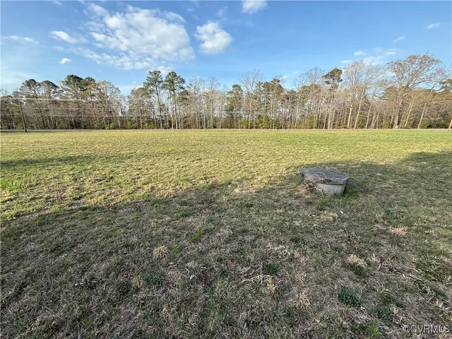 a view of a field with an ocean