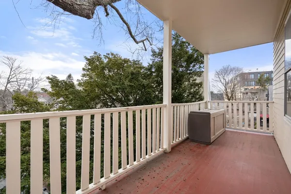 a view of a chair and table in the balcony
