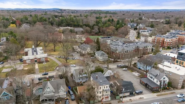 an aerial view of residential building and parking space