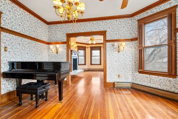 a view of livingroom with furniture wooden floor and a fireplace