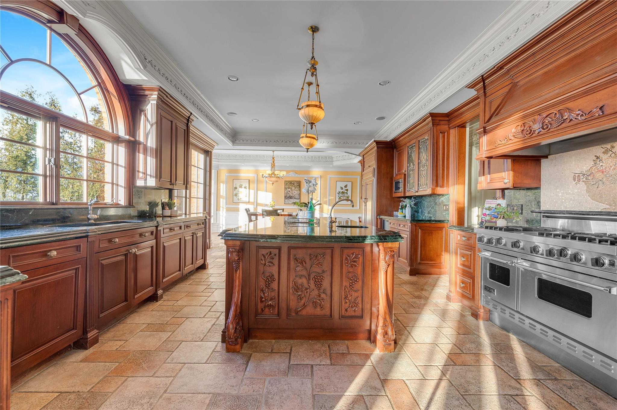 3 Point Crescent Queens, NY 11357 - Photo 14 of 38 Kitchen with range with two ovens, ornamental molding, glass insert cabinets, tasteful backsplash, and stone tile floors
