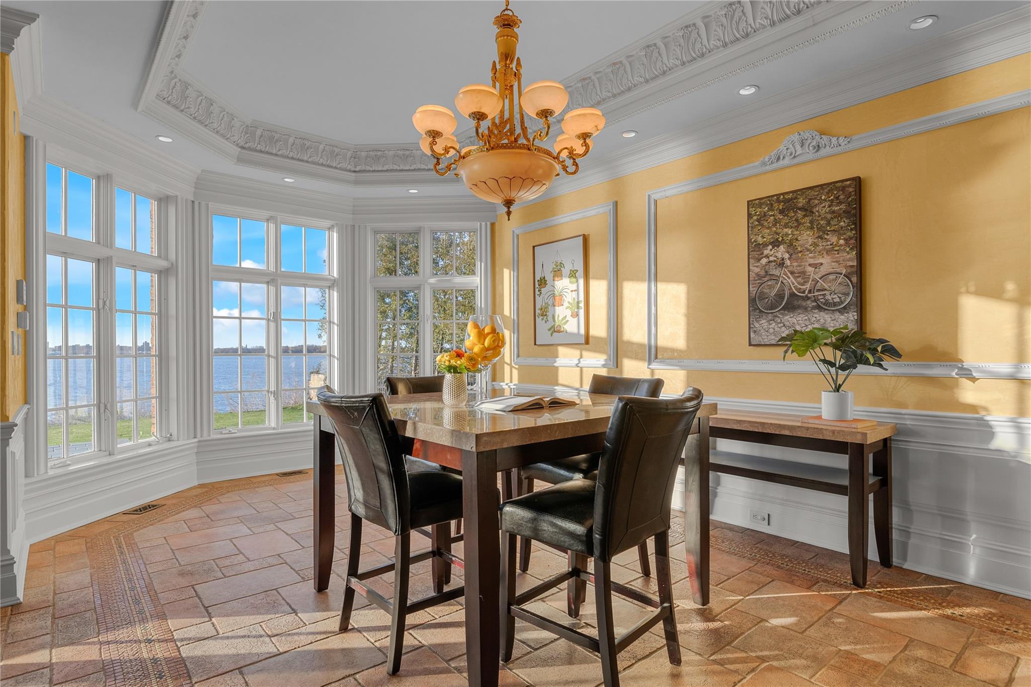3 Point Crescent Queens, NY 11357 - Photo 18 of 38 Dining room with stone tile floors, a water view, ornamental molding, a chandelier, and recessed lighting