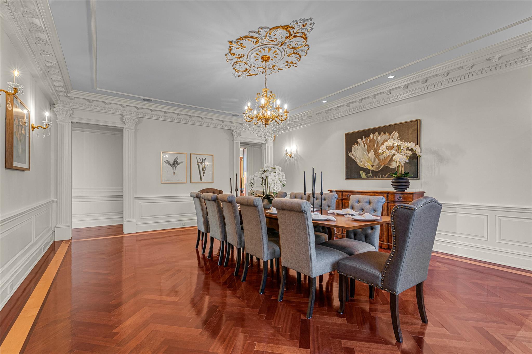 3 Point Crescent Queens, NY 11357 - Photo 20 of 38 Dining room with a chandelier, a decorative wall, ornamental molding, and a wainscoted wall