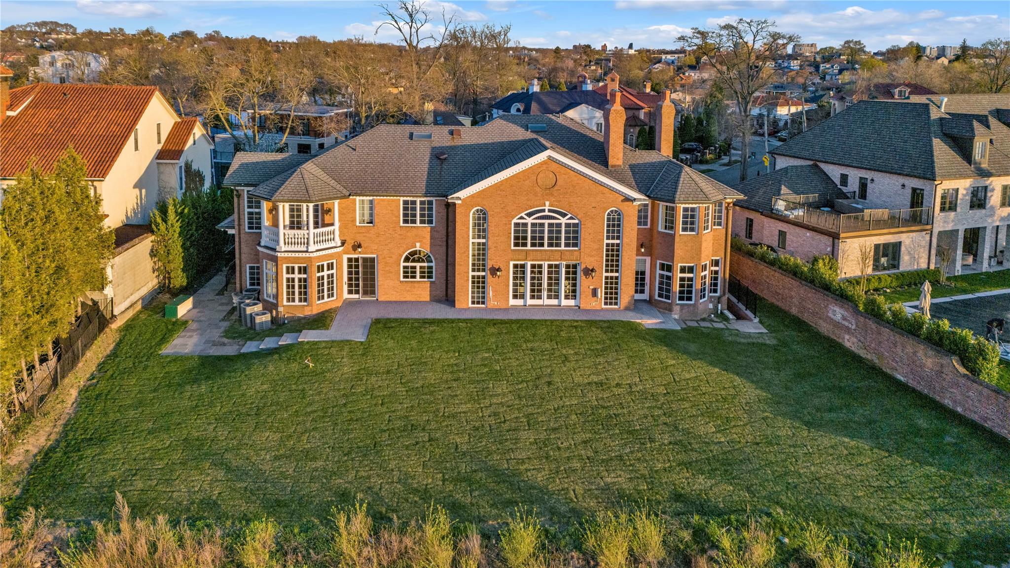 3 Point Crescent Queens, NY 11357 - Photo 31 of 38 Back of house with french doors, a patio, a chimney, and a residential view