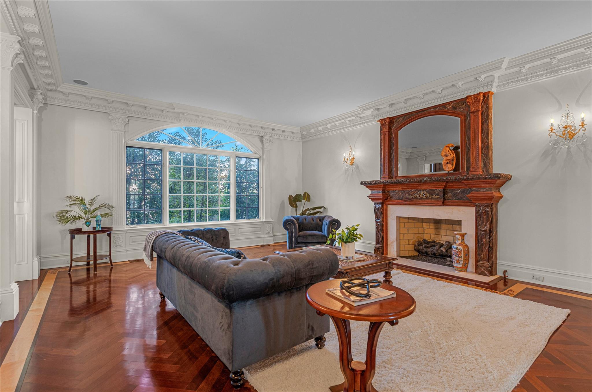 3 Point Crescent Queens, NY 11357 - Photo 6 of 38 Living room with a fireplace, crown molding, and a chandelier