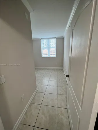 a view of a room with white door and cabinet
