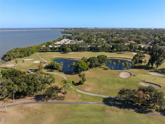 an aerial view of a house with a swimming pool