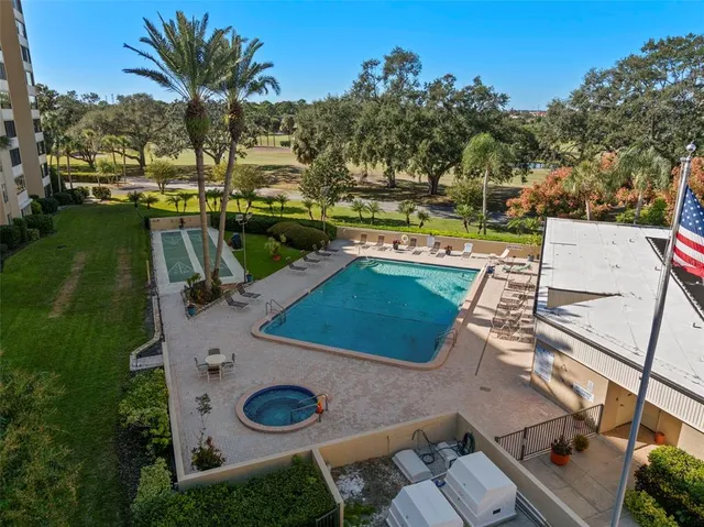 a view of building with cars parked