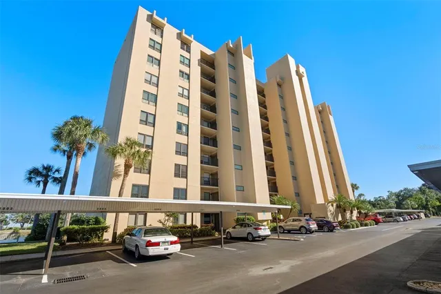 a street with lots of cars parked in front of it