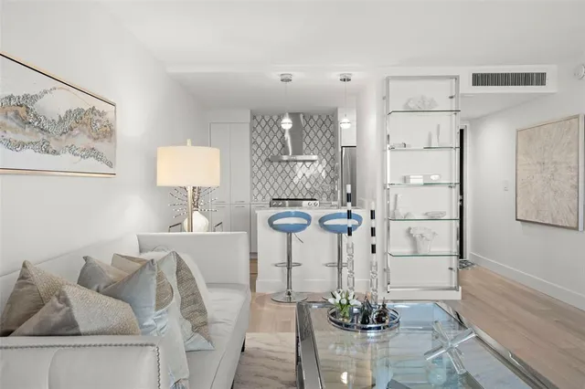 a large bedroom with a bed and couch