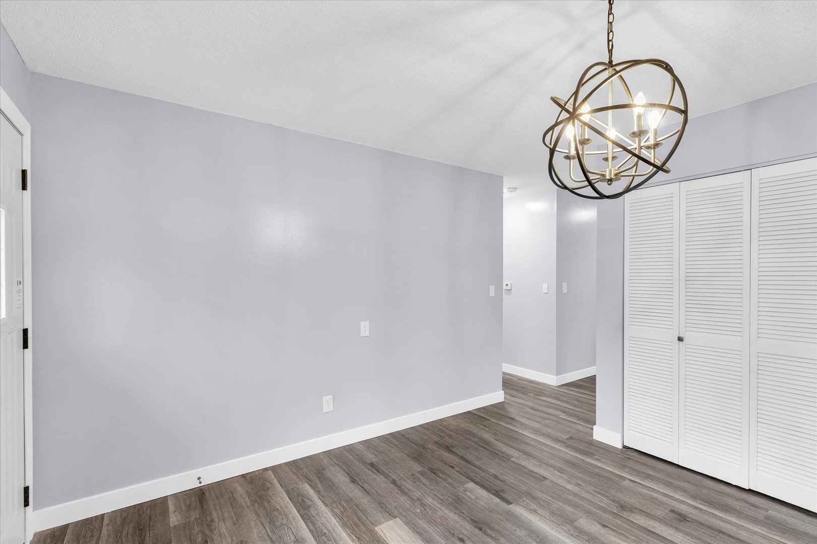 945 North Oakland Avenue Decatur, IL 62522 - Photo 11 of 49 a view of a room with wooden floor and white walls