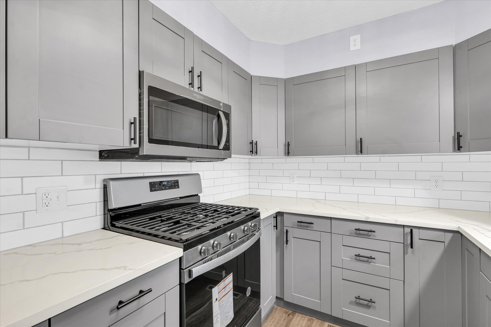 945 North Oakland Avenue Decatur, IL 62522 - Photo 15 of 49 a kitchen with granite countertop cabinets stainless steel appliances and wooden cabinets