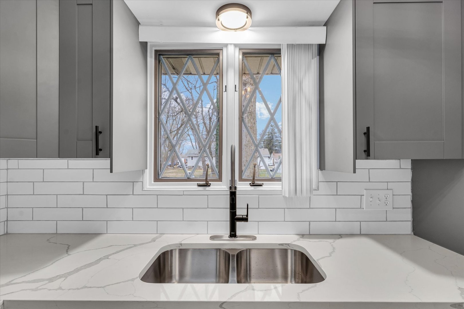 945 North Oakland Avenue Decatur, IL 62522 - Photo 17 of 49 a bathroom with a sink and a mirror