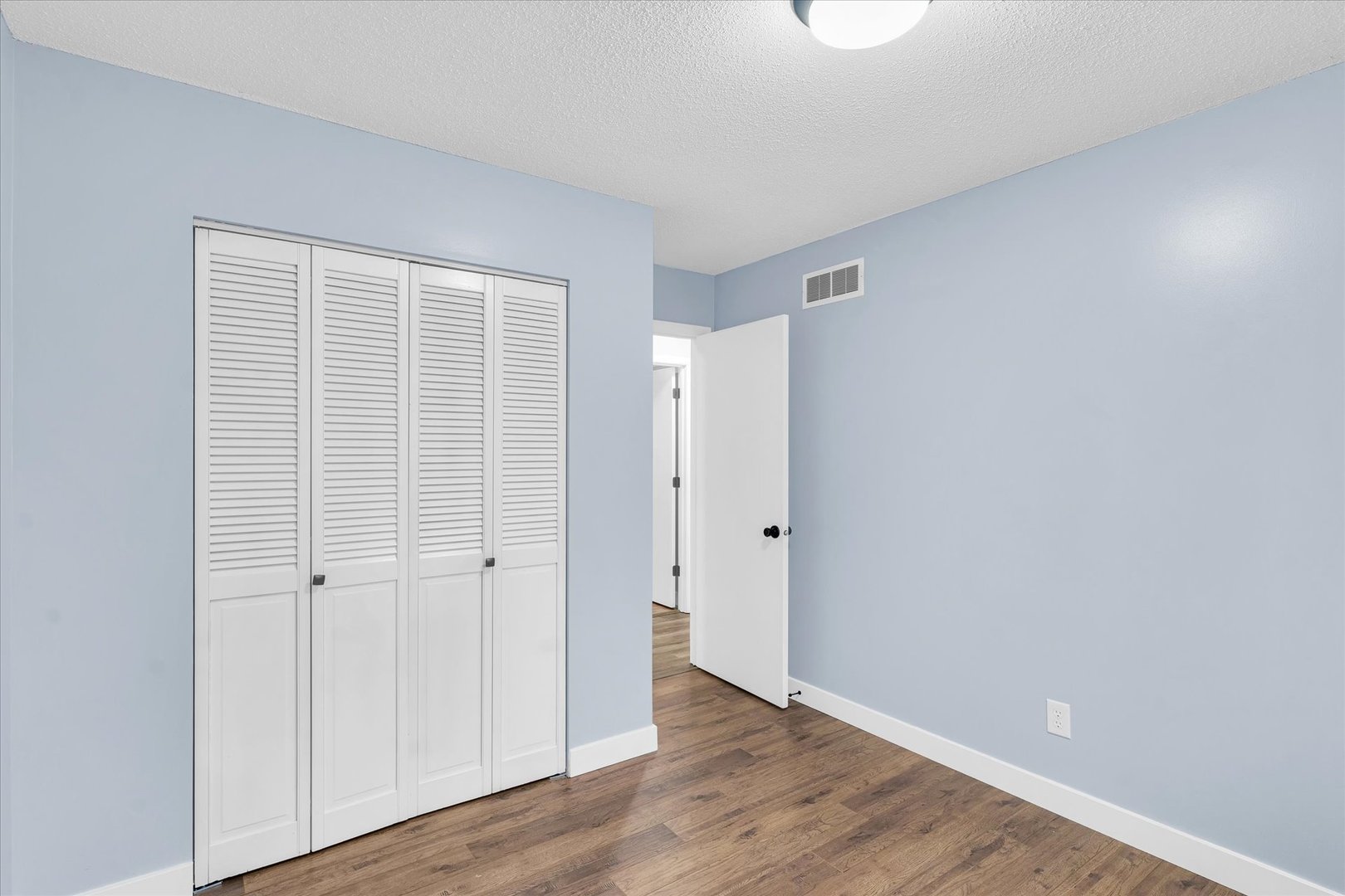 945 North Oakland Avenue Decatur, IL 62522 - Photo 23 of 49 a view of an empty room with wooden floor