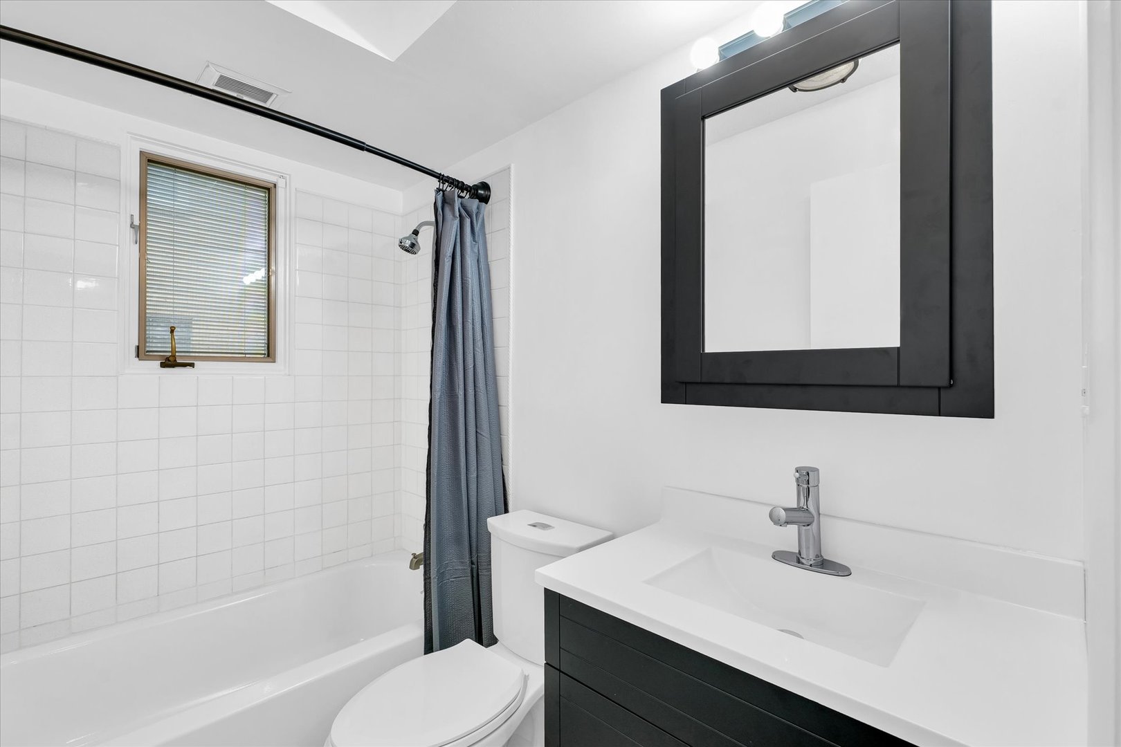 945 North Oakland Avenue Decatur, IL 62522 - Photo 24 of 49 a bathroom with a sink vanity mirror and toilet