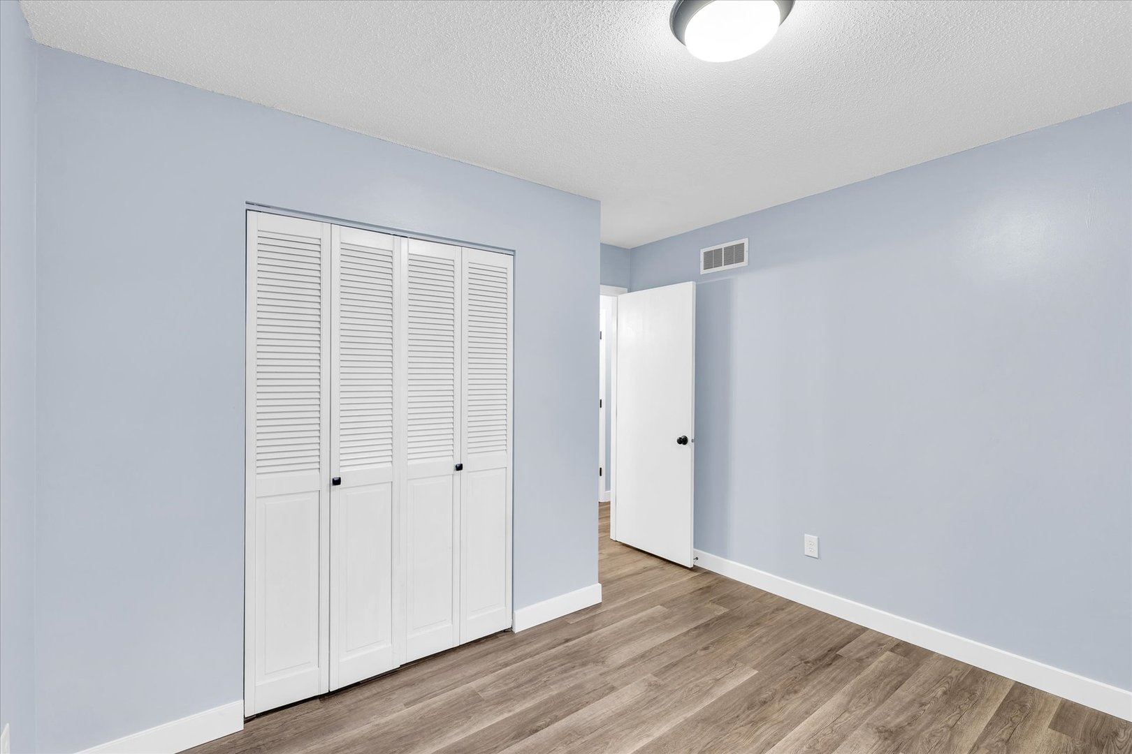 945 North Oakland Avenue Decatur, IL 62522 - Photo 26 of 49 a view of an empty room with wooden floor
