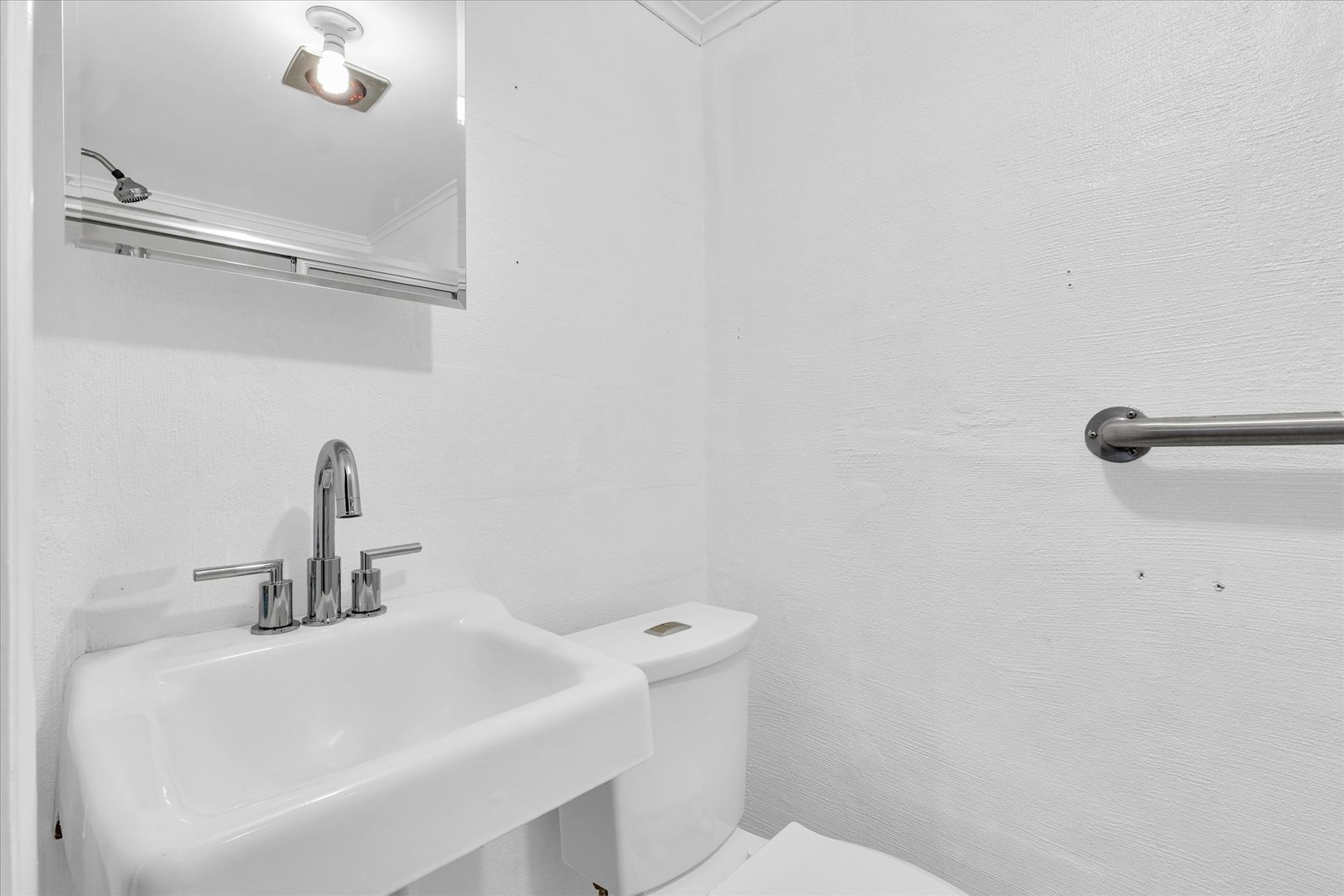 945 North Oakland Avenue Decatur, IL 62522 - Photo 40 of 49 a bathroom with a sink a toilet and a mirror
