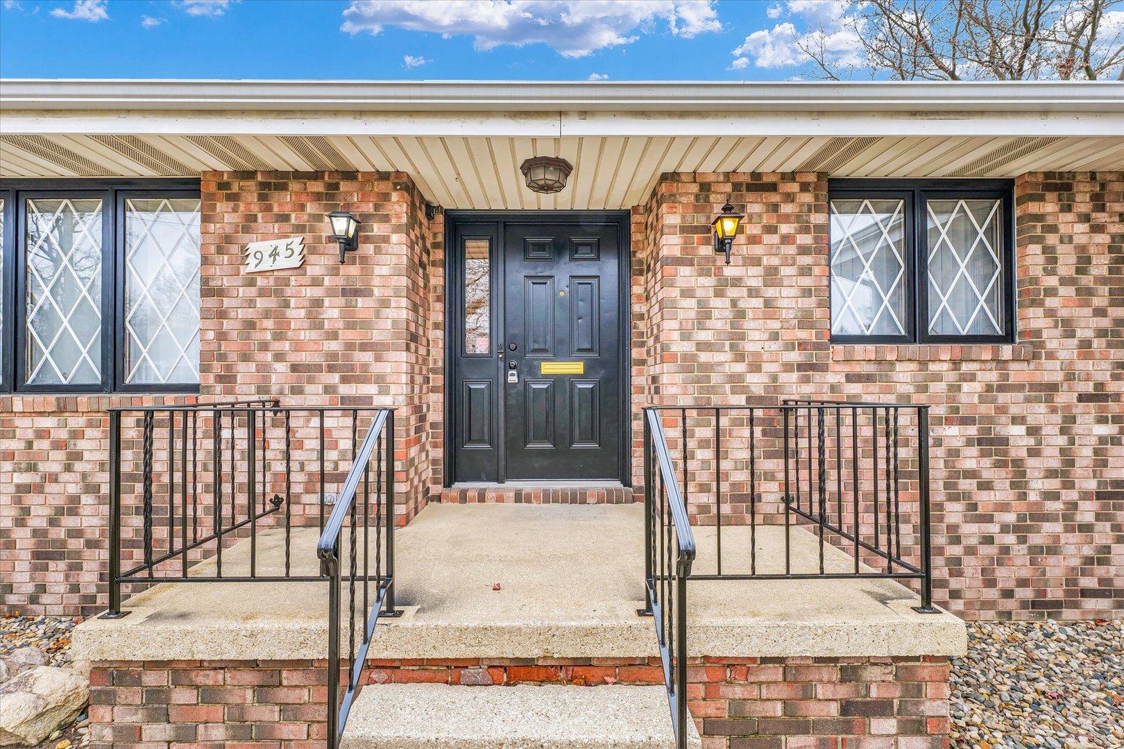 945 North Oakland Avenue Decatur, IL 62522 - Photo 5 of 49 a front view of a house with a glass door