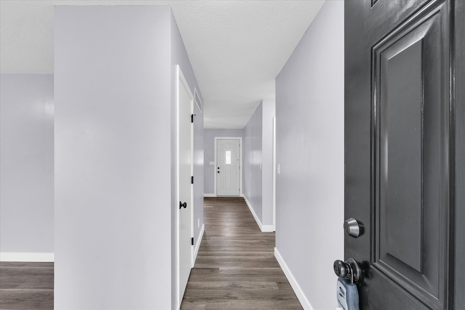 945 North Oakland Avenue Decatur, IL 62522 - Photo 6 of 49 a view of a hallway with wooden floor and staircase
