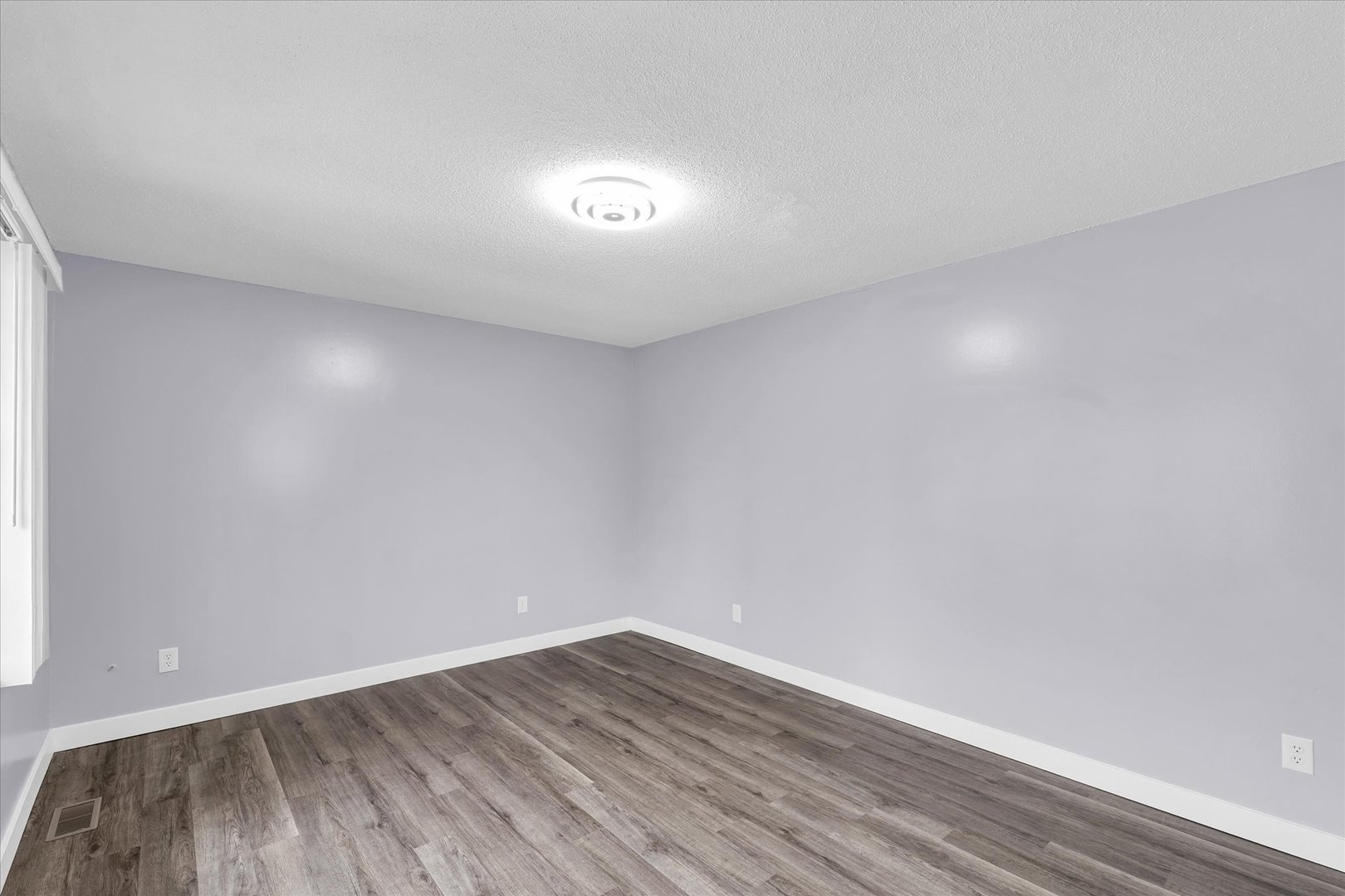945 North Oakland Avenue Decatur, IL 62522 - Photo 7 of 49 a view of an empty room with wooden floor