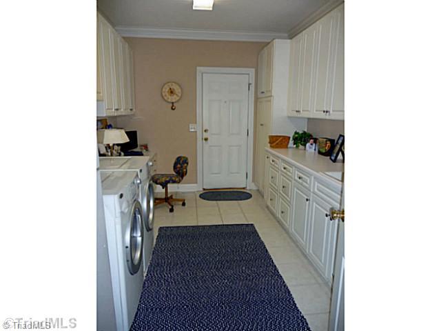 8519 Rosedale Drive Oak Ridge, NC 27310 - Photo 8 of 16 Laundry Room. This fabulous, oh so handy, tiled laundry room is also used as a hobby room . A desk area provides extra office space for a family member.