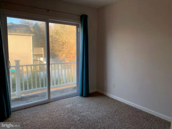 a view of empty room with front door