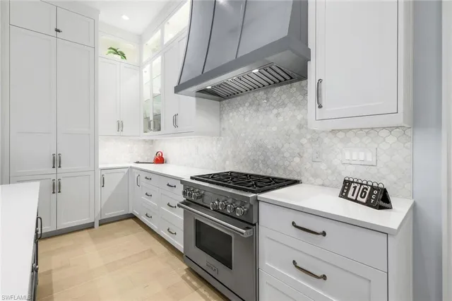 a bathroom with a granite countertop sink toilet a mirror a vanity and shower