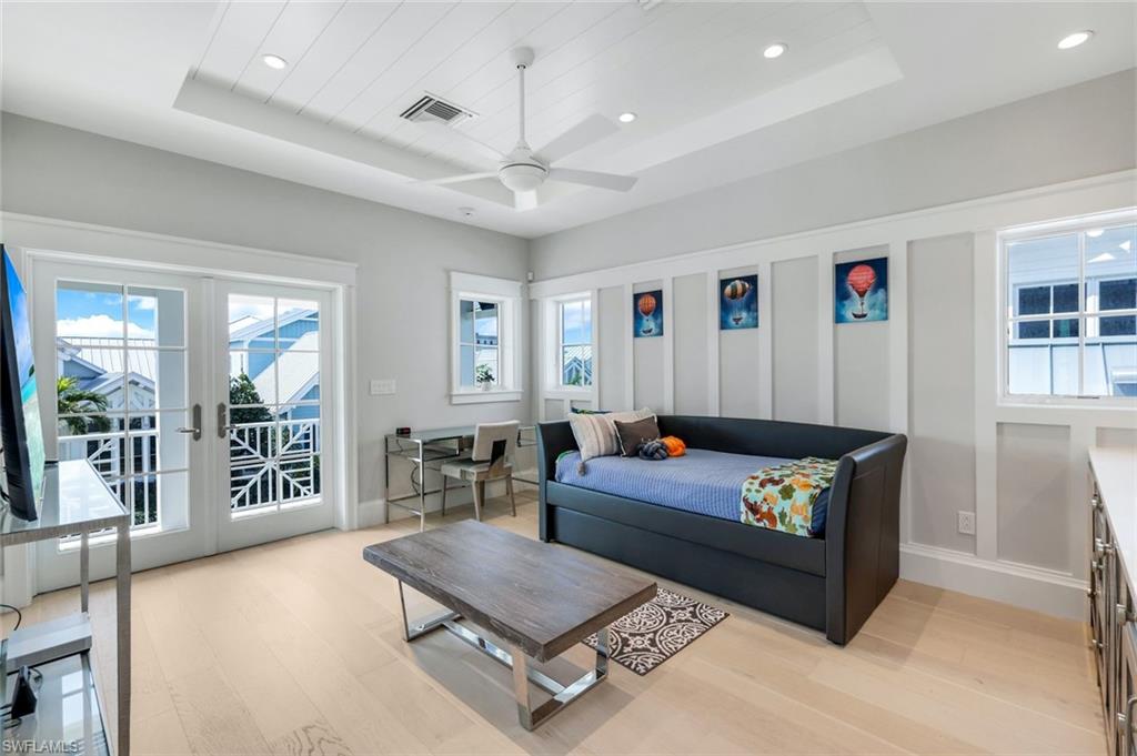 1463 2nd Avenue South Naples, FL 34102 - Photo 25 of 43 a living room with furniture and a table