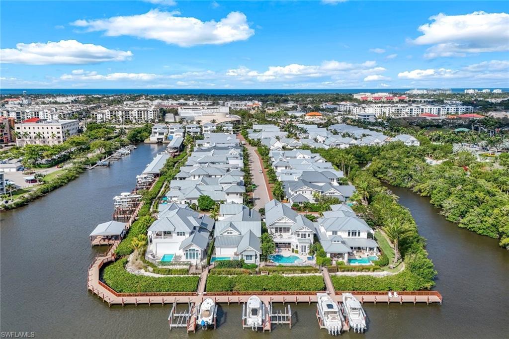 1463 2nd Avenue South Naples, FL 34102 - Photo 39 of 43 an aerial view of a city with lots of residential buildings ocean and mountain view in back