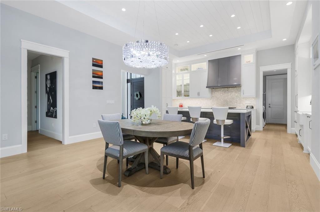 1463 2nd Avenue South Naples, FL 34102 - Photo 6 of 43 a view of a dining room with furniture and chandelier