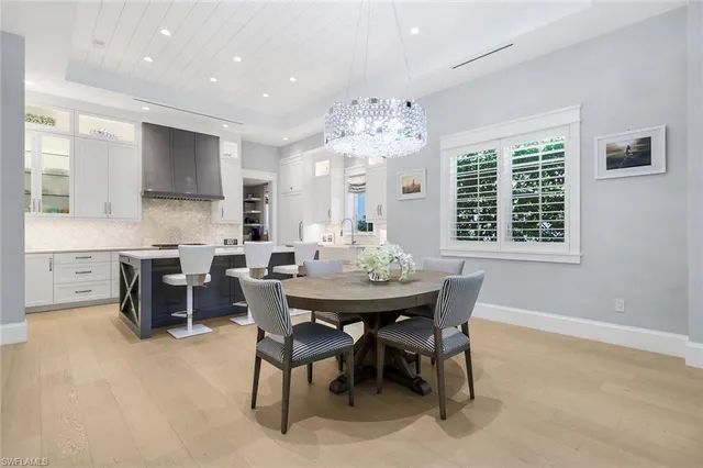 a bedroom with a large bed and a large window