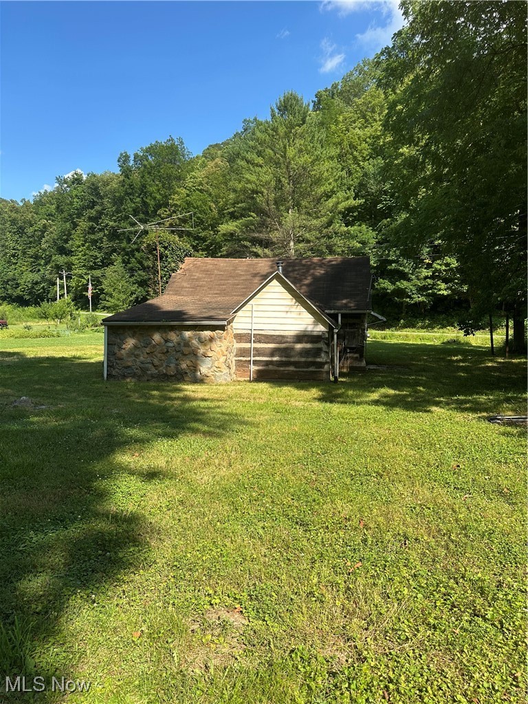 37114 Barber Ridge Road Woodsfield, OH 43793 - Photo 27 of 50 View of grassy yard featuring a wooded view