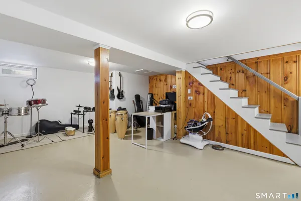 a view of a livingroom with stairs furniture