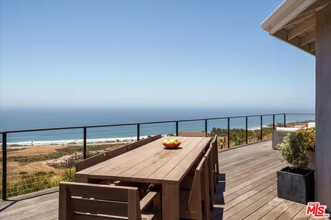 a view of a patio with wooden floor