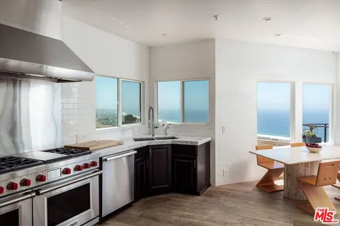 a kitchen with a stove and a sink