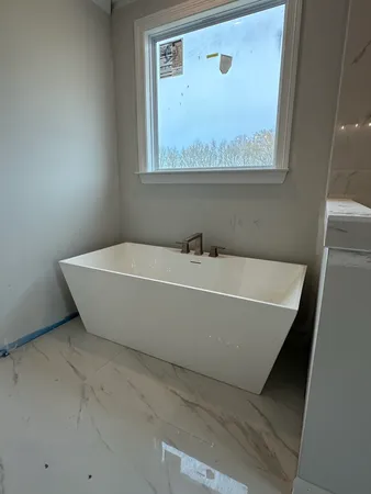 a view of an empty room and a windows